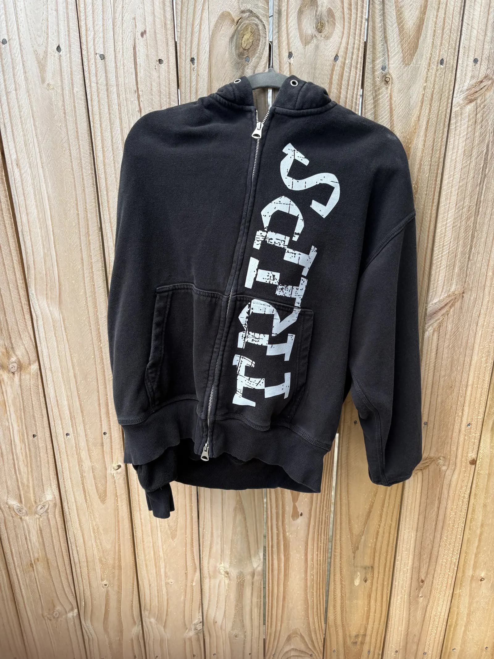 Black World Wide TRIPS zip-up with vertical lettering
